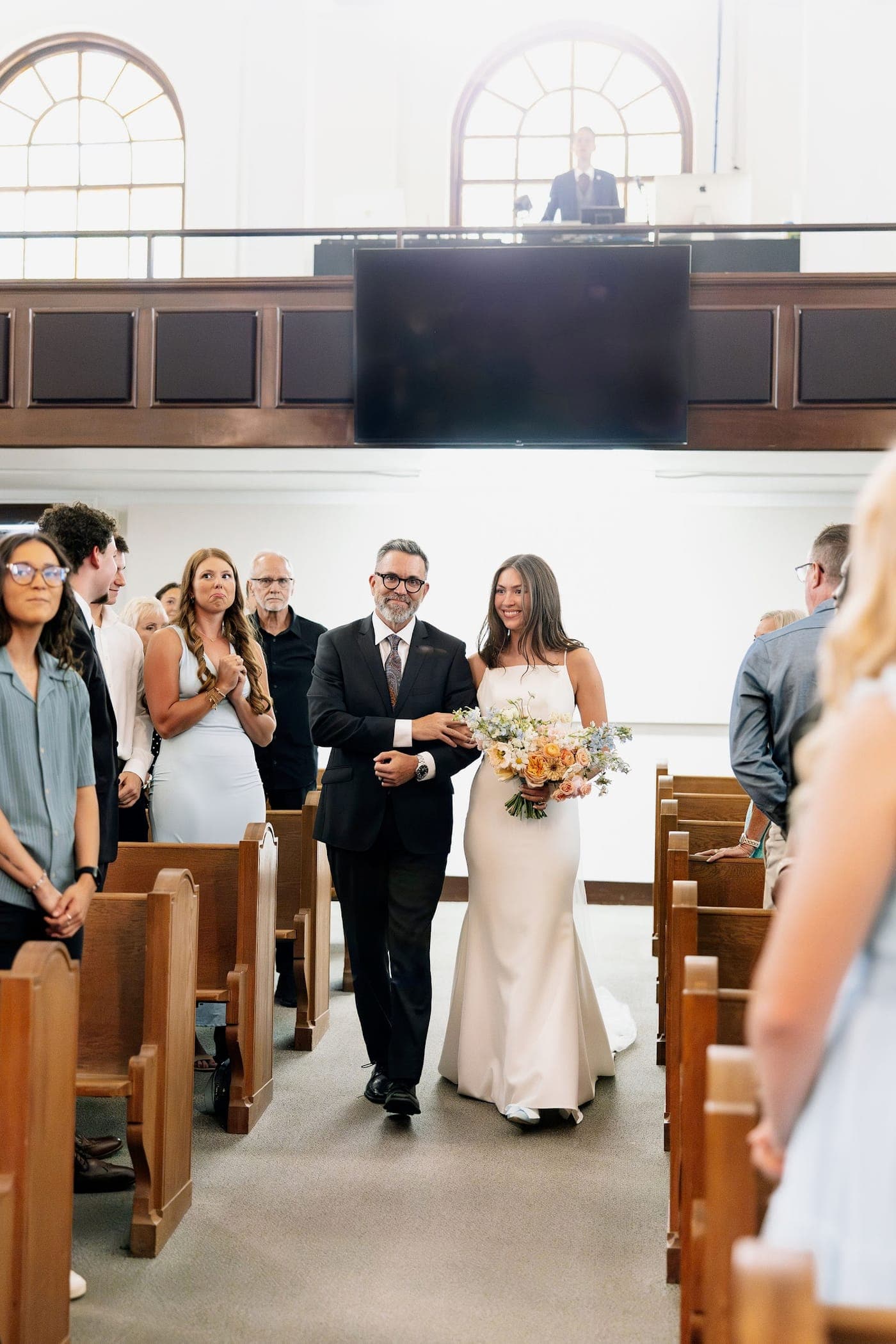 Terry walking Reia down the aisle